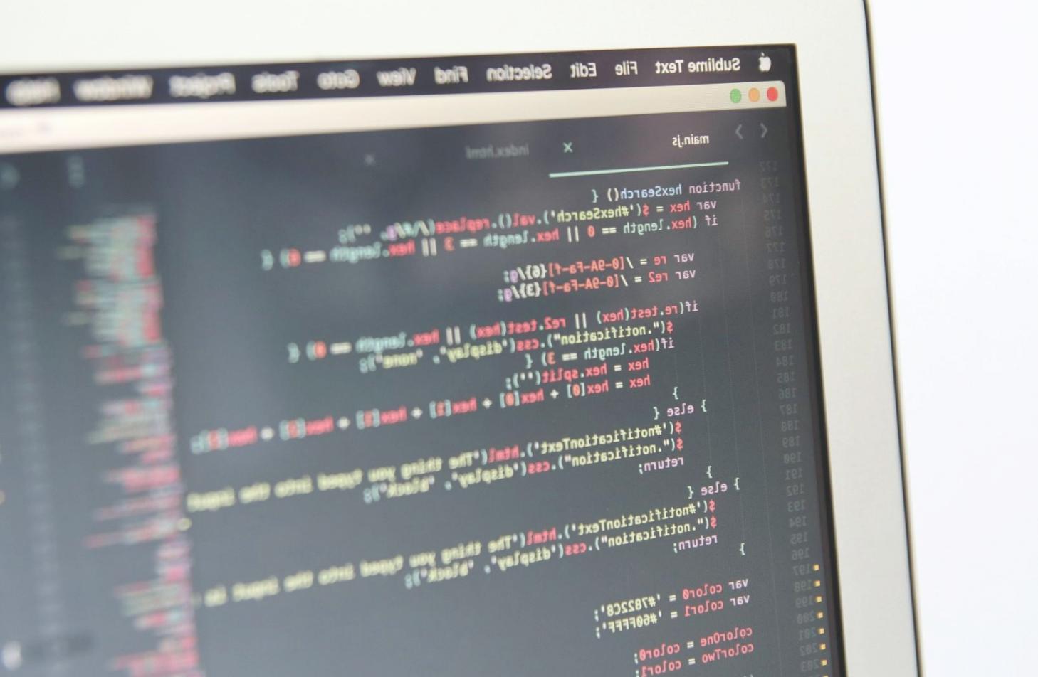 Game development workspace showing code editor with JavaScript game logic and development tools
